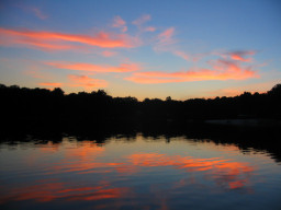 Sunset-lit clouds and their reflections.